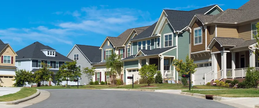 Street of suburban residential houses with porches